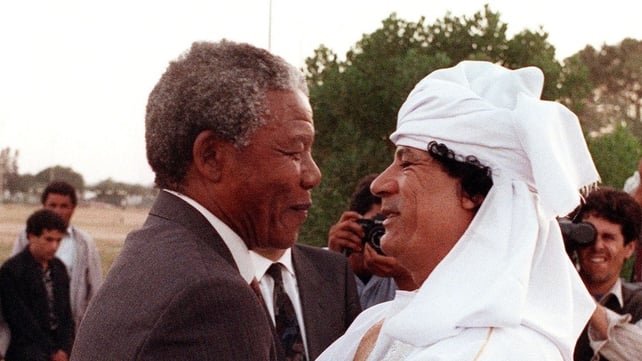 Nelson Mandela and Libyan leader Muammar Gaddafi hug on 18 May 1990, upon Mandela's arrival to Tripoli