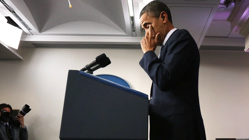 Barack Obama wipes away tears as he makes a statement in response to the elementary school shooting in Connecticut