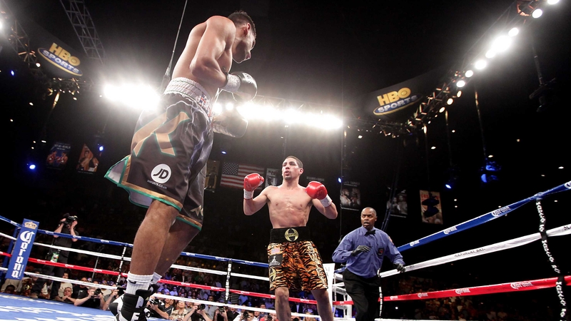 Danny Garcia (right) advances on Amir Khan at the Mandalay Bay Events Center in Las Vegas