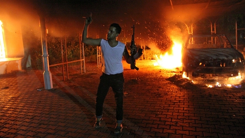 Buildings and cars engulfed in flames after being set on fire inside the US consulate on 11 September
