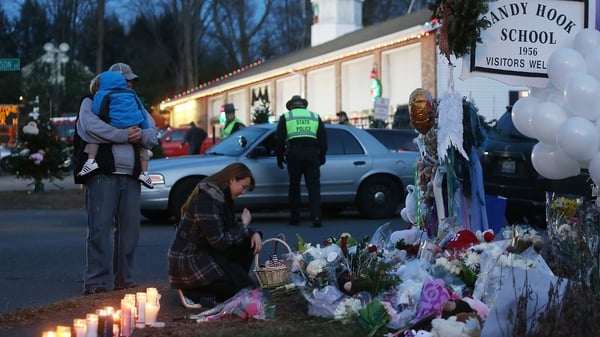 People have been paying their respects at a makeshift memorial near the scene of last week's shooting