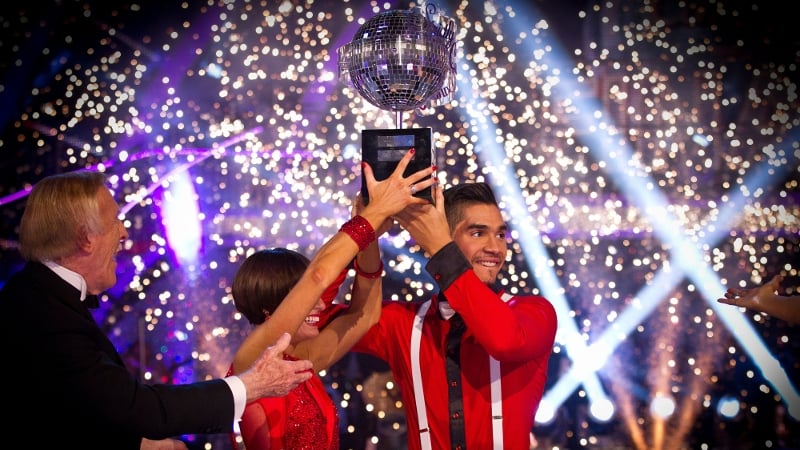Louis Smith and Flavia Cacace hold up the glitterball trophy