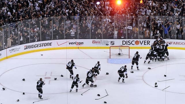 The Los Angeles Kings discard their helmets and sticks in celebration as they win the Stanley Cup in June