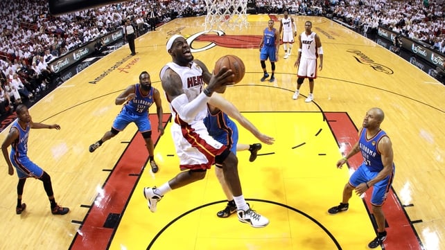 LeBron James soars for a slam dunk for Miami Heat against Oklahoma City Thunder