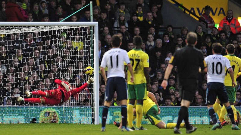 Chelsea's Spanish midfielder Juan Mata (second from right) scores the Blues' winner past the dive of Norwich's keeper Mark Bunn (left)