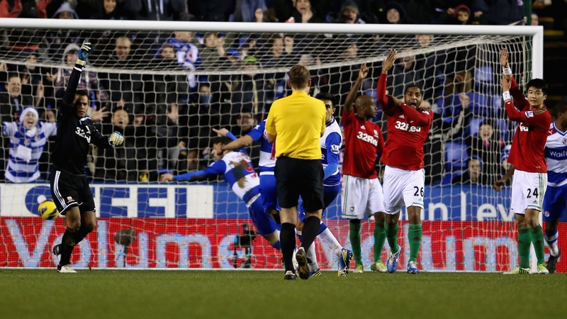 Swansea players react to the disallowed goal by Adam Le Fondre