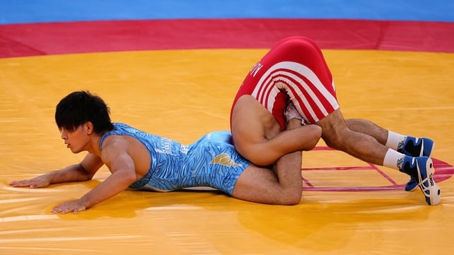 Ashraf Aliyev of Azerbaijan in an awkward position during the wrestling event