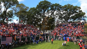 Bubba Watson tees off for the US on the final day, with the home team enjoying a commanding lead