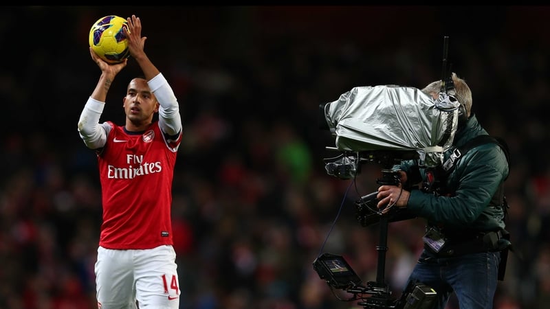 Theo Walcott paraded the match ball around the Emirates at full-time