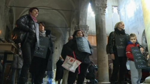 Women with placards in the church