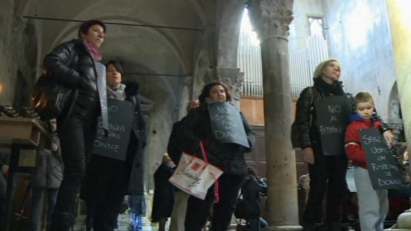 Women with placards in the church