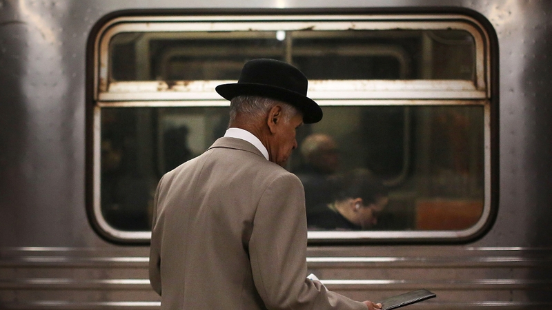 A man wait for a subway train in Manhattan