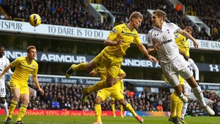 Michael Dawson scores a headed goal for Tottenham against Reading
