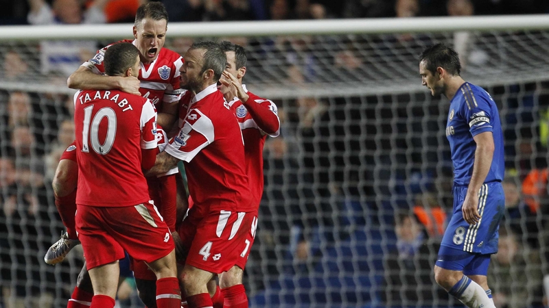 QPR players celebrate Shaun Wright-Phillips' goal as Frank Lampard looks dejected