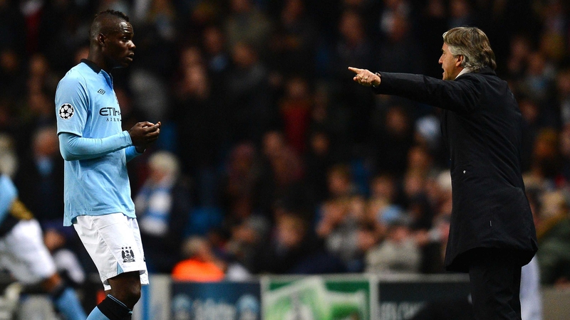 Mario Balotelli appeared to be dragged away from manager Roberto Mancini during the contretemps