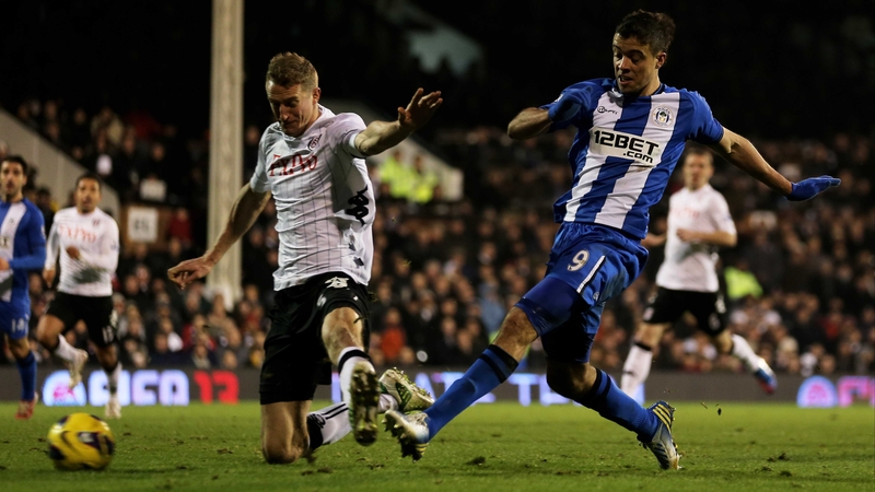 Franco Di Santo gets his shot away despite the attention of Brede Hangeland