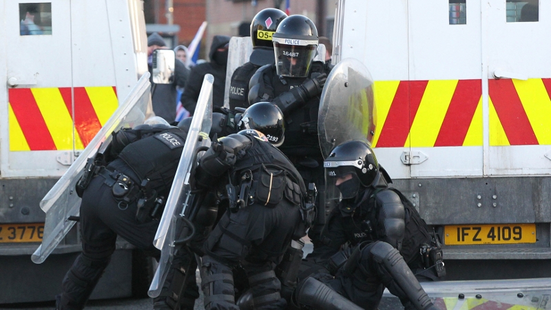 PSNI officers attend an injured colleague