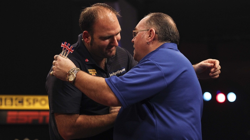 Scott Waites (left) embraces Tony O'Shea after winning the final of the BDO Lakeside World Professional Darts Championships at the Lakeside Country Club