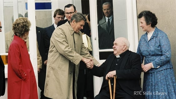 President Reagan shakes hands with Father John Murphy