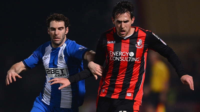 Charlie Daniels of Bournemouth and Mauro Boselli of Wigan