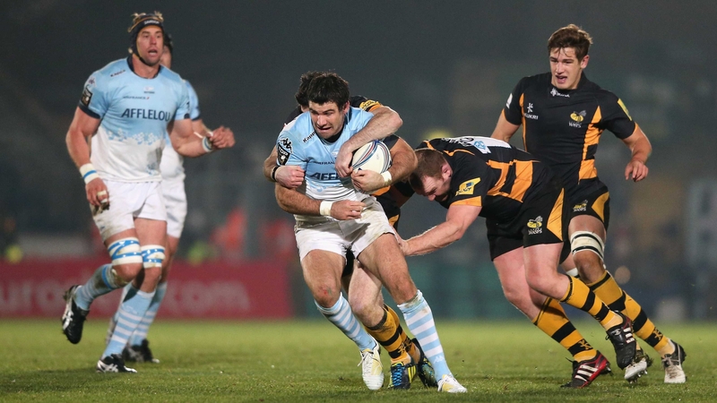 Mike Phillips of Bayonne is tackled by Wasps' Stephen Jones and Tim Payne during the sides' Amlin Challenge Cup clash at Adams Park