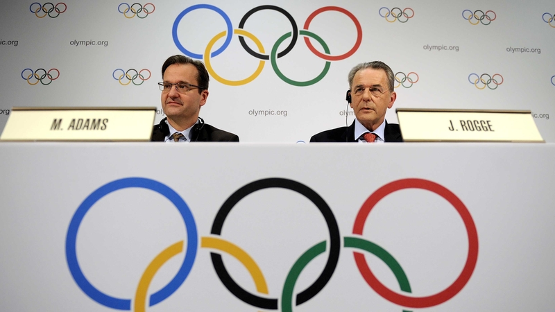 International Olympic Committee director of communications Mark Adams (left), pictured with IOC president Jacques Rogge (right)