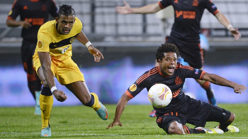 Loic Remy (right) fights for the ball with Limassol defender Dosa Junior (left)