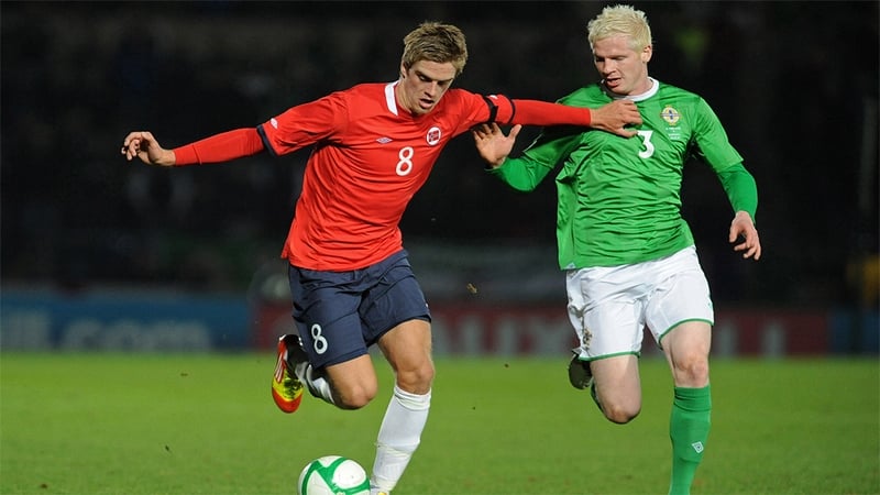 Northern Ireland's Ryan McGivern (right) vies with Norway's Markus Henriksen (left) during an international friendly match