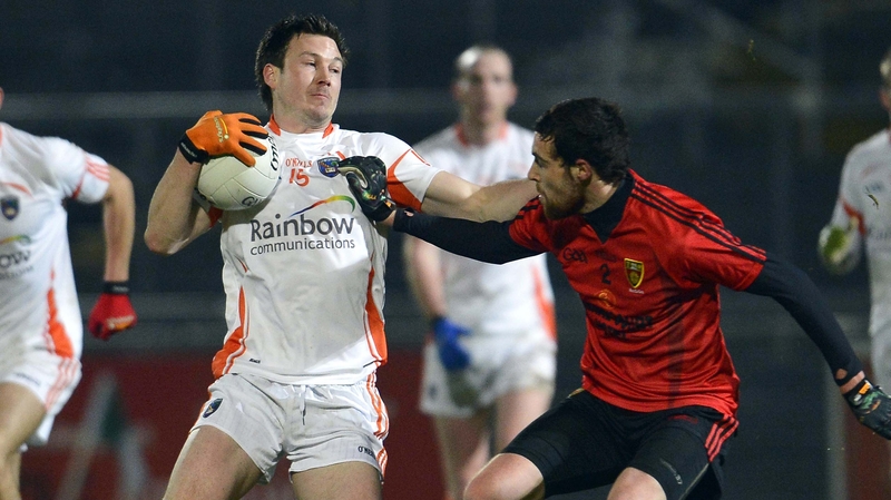 Armagh's Stefan Forker tussles with Down's Gerard McAnulty