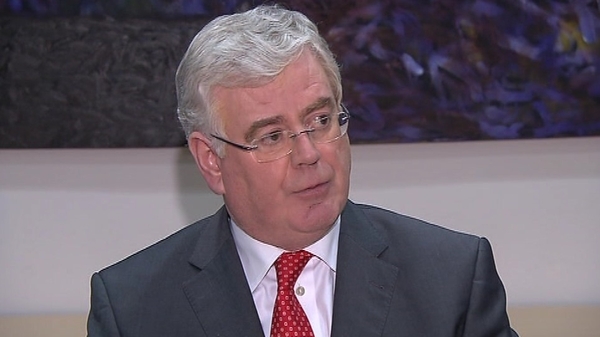 Eamon Gilmore praised the work of community leaders in Northern Ireland