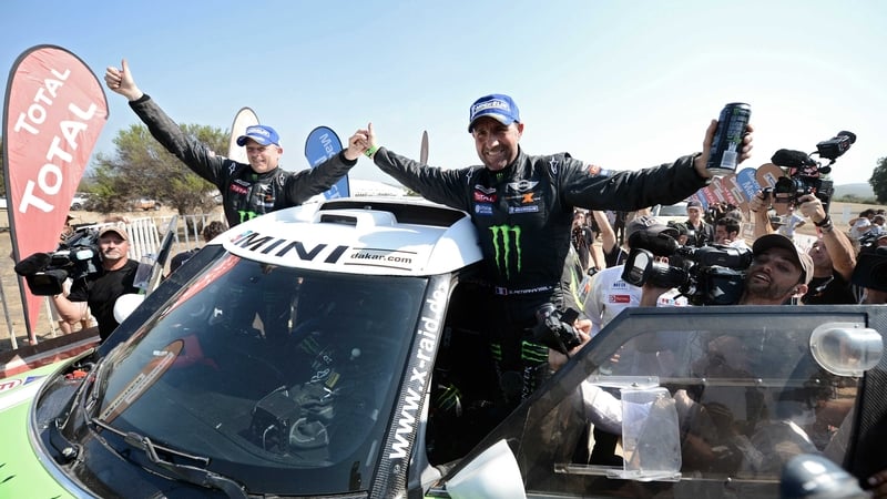 Stephane Peterhansel celebrates his latest Dakar success with co-driver Jean Paul Cottret