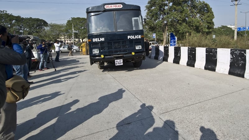 A prisoner transport vehicle, believed to be ferrying the accused, enters the district court in New Delhi