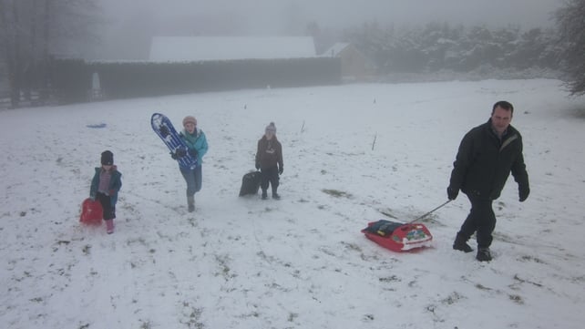 Greg Keating and his children enjoy sleighing and snowboarding at Buttermountain, Brittas, Co Dublin (Adam Keating)