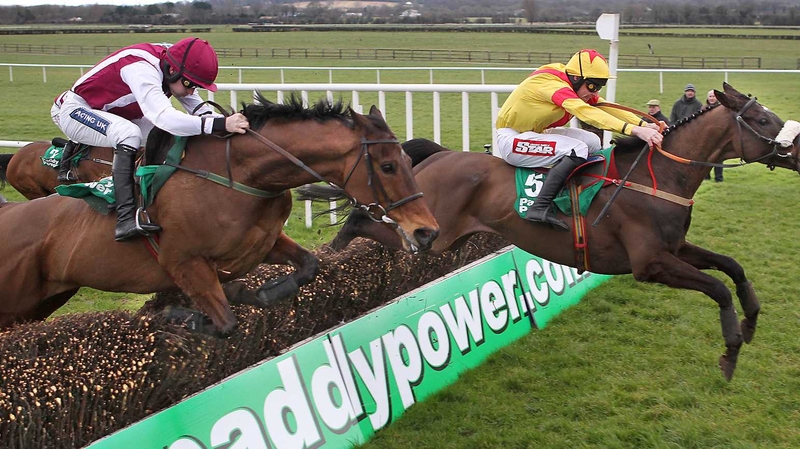 Ruby Walsh on Seabass (left) clears the last alongside Davy Russell on Zaarito