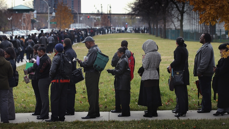 Jobseekers in the US queue to attend a jobs fair in Chicago