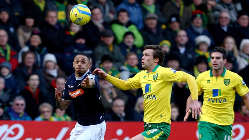 Luton's Andy Gray and Jonathan Howson of Norwich battle for posession