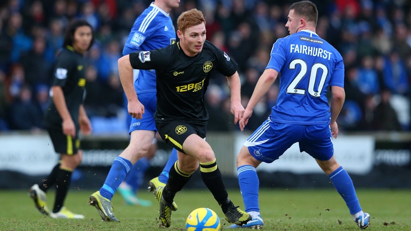 Wigan's Fraser Fyvie breaks away from Waide Fairhurst of Macclesfield
