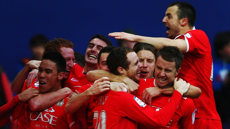 The Dons celebrate Ryan Harley's goal just after half time