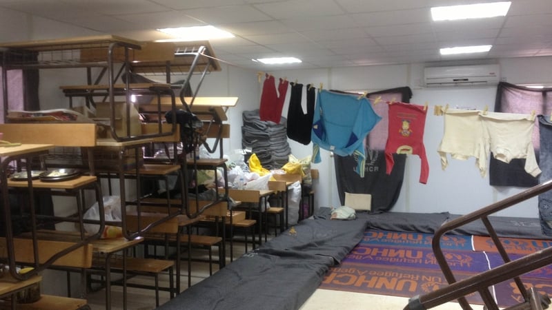 One family has set up home in a classroom after they were forced to abandon their tent