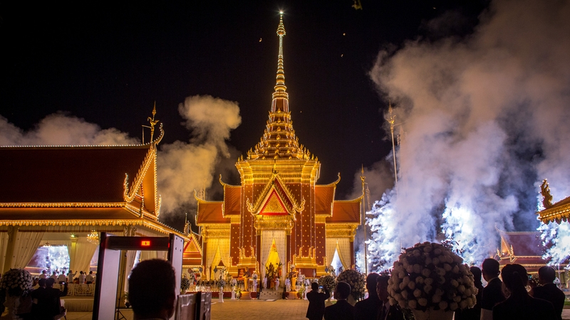 People watched as fireworks marked the end of the cremation ceremony in Phnom Penh