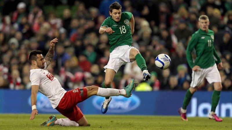 Wes Hoolahan hurdles a tackle during Ireland's 2-0 international friendly against Polan