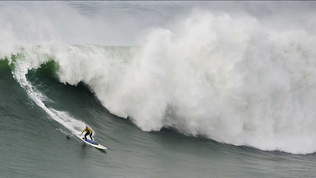 US surfer Garrett McNamara rides a wave during a surf session at Praia do Norte in Nazare