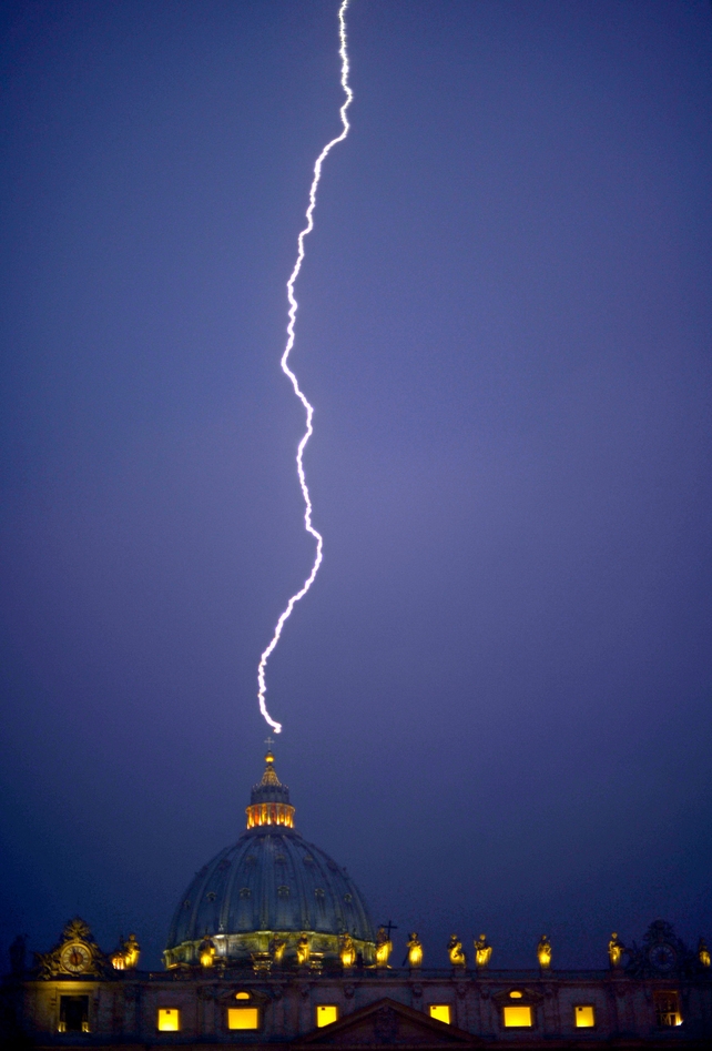 Lightning strikes St Peter's dome at the Vatican just hours after the Pope announced his retirement