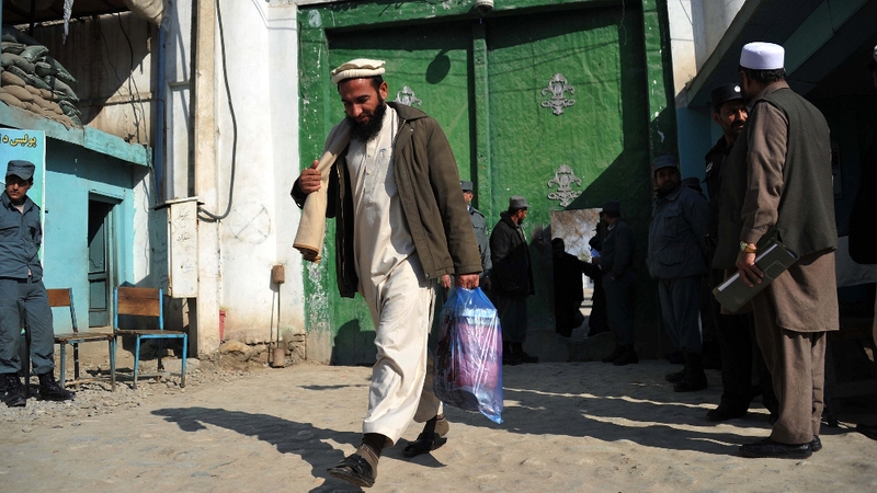 A freed Afghan prisoner leaves the main prison in Jalalabad yesterday as part of an amnesty introduced by President Hamid Karzai