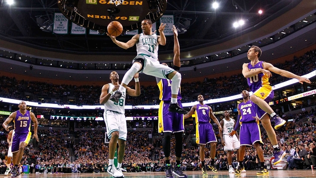 Courtney Lee of the Boston Celtics goes midair at TD Garden in Boston, Massachusetts