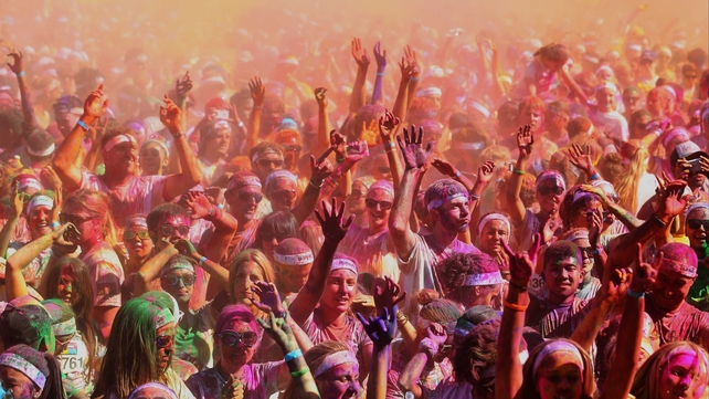 Runners party at Sydney Olympic Park after completing the Colour Run