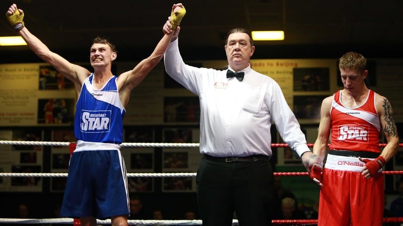 Sean McComb shows his delight as his hand is raised in victory after beating the much-fancied Eric Donovan