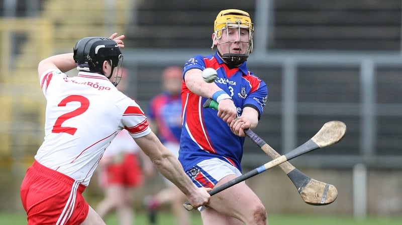 Anthony Kelly of St Thomas' and Paul Gillan of Loughgiel Shamrocks