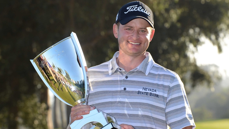 John Merrick poses with the Northern Trust Open trophy after a play-off win over Charlie Beljan