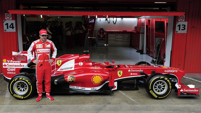 Fernando Alonso poses with the Ferrari F138 at the Catalunya race track